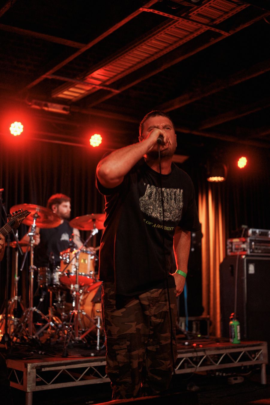 Resin Tomb's vocalist parks and barks with the drummer behind him.