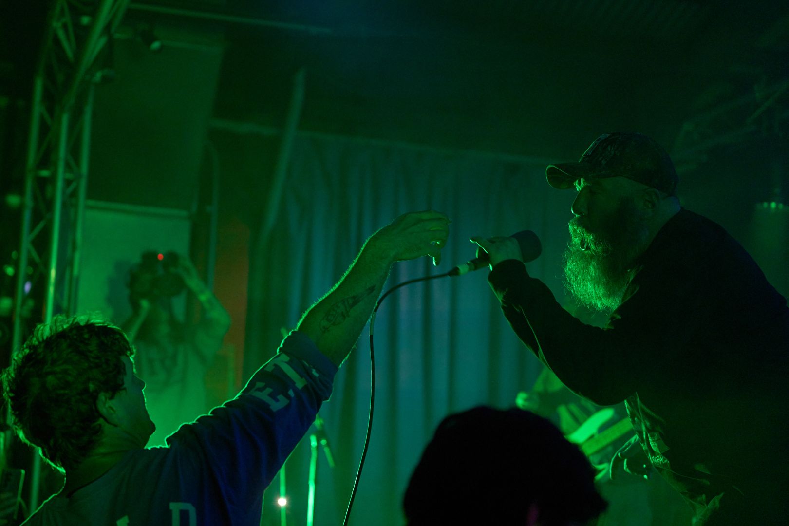 The vocalist reclaims the mic after some crowd assist vocals.