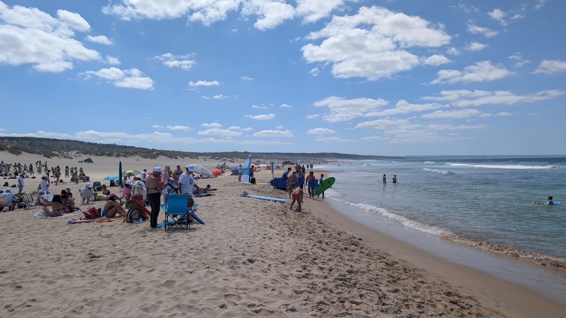 People at the beach in Lisbon, despite many people being there, there was plenty of room just like an Aussie beach.