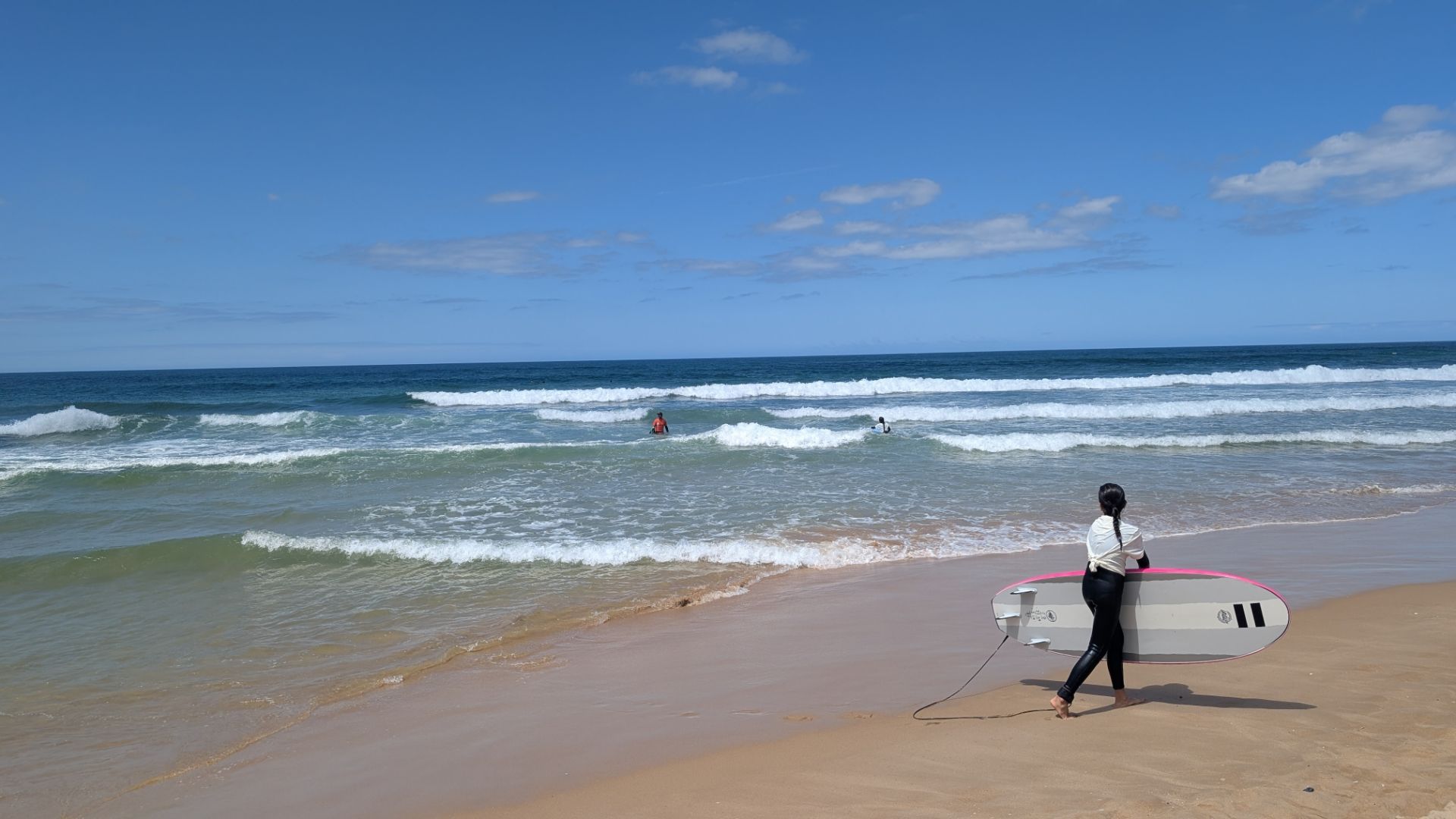 A surfer at the beach in Lisbon