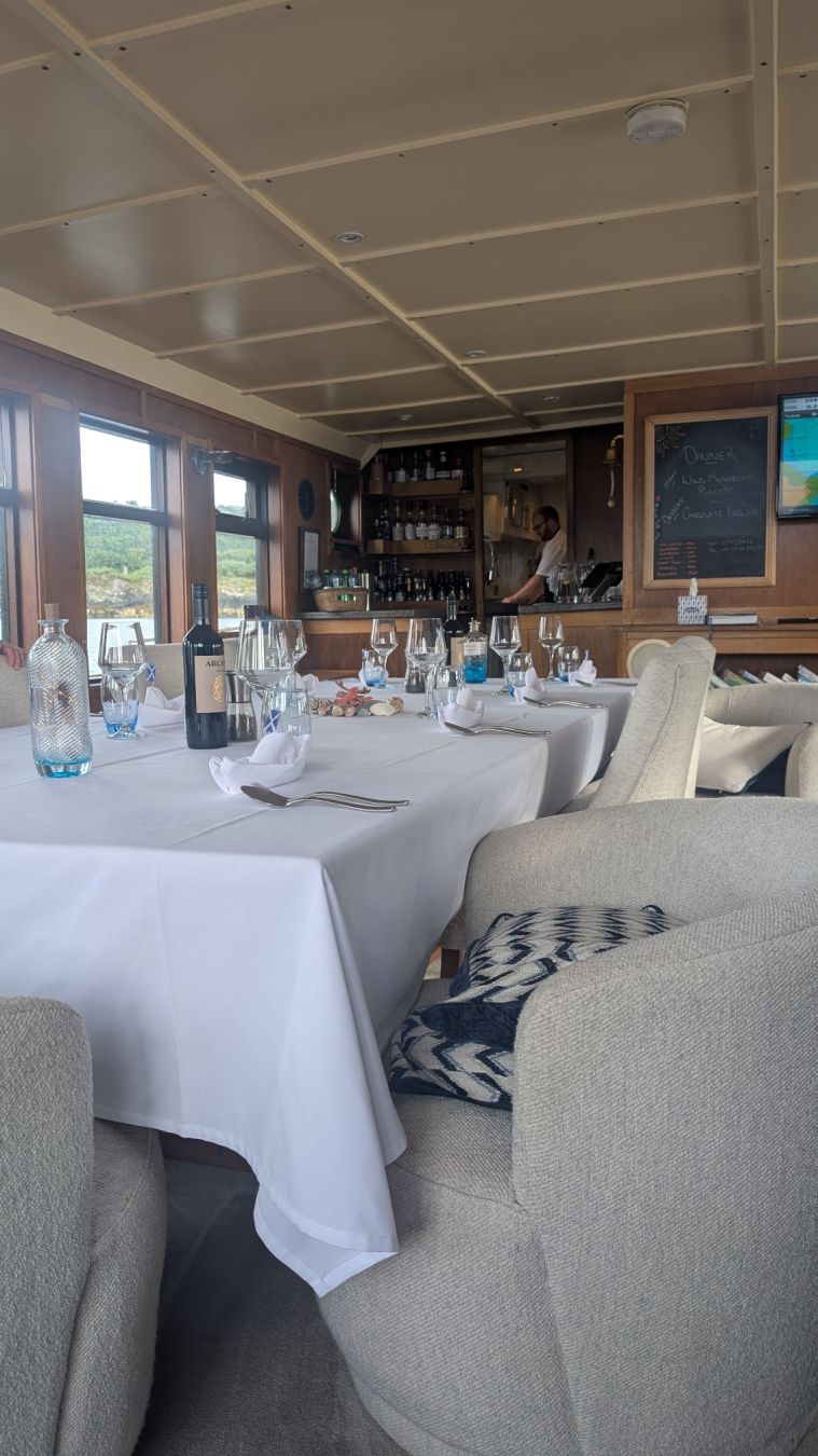 The salon, where far too much lovely food was had. A large table with a white table cloth and lovely table decorations