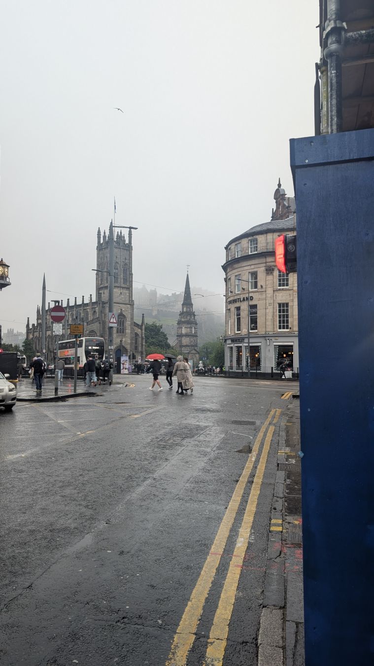The Edinburgh castle in the distance on a grey day.