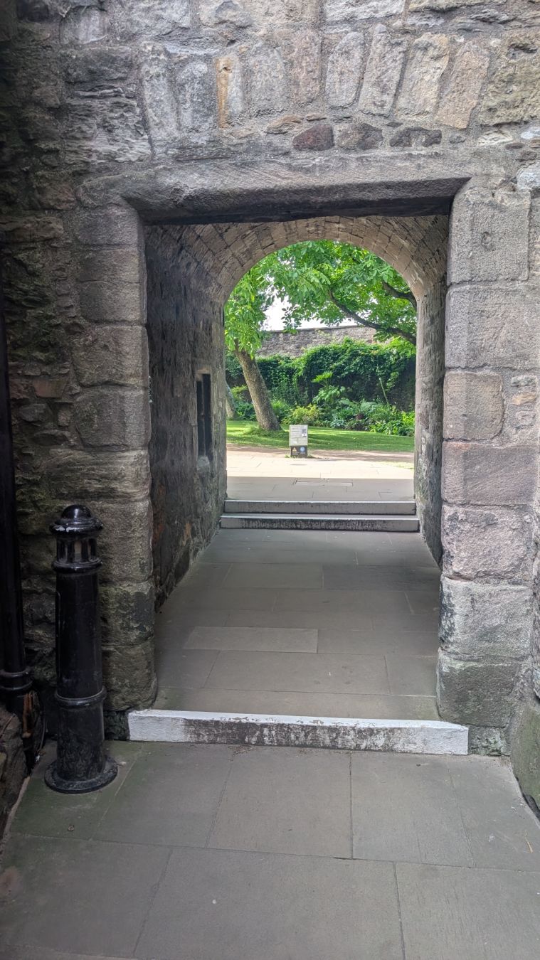A stone corridor to a secret garden