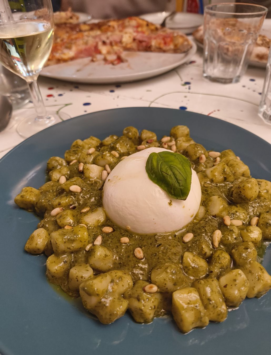 Gnocchi with basil pesto, extra virgin olive oil, pine nuts, parmesan and burrata